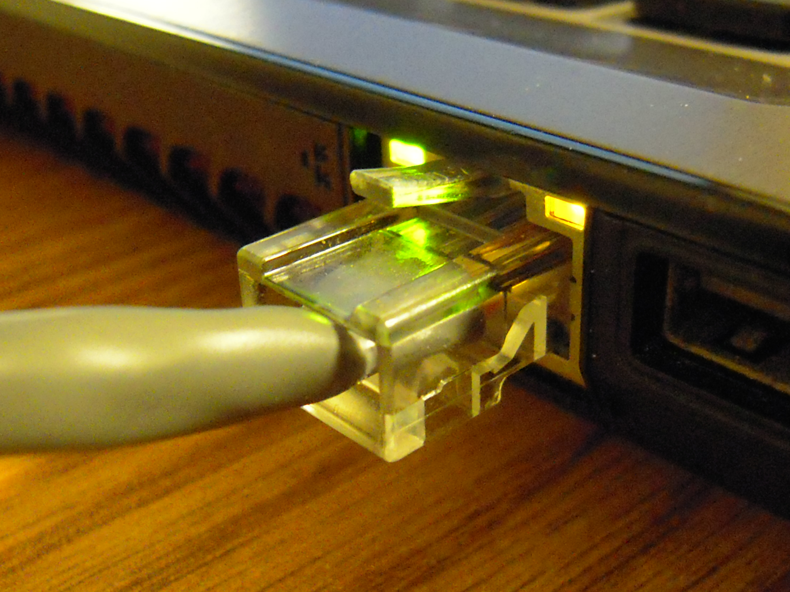 A computer with a network cable connected to it.