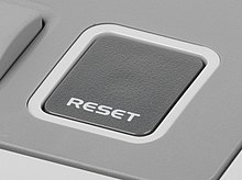 Computer with restart button